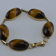Laden Sie das Bild in den Galerie-Viewer, Vintage Armband mit Tigerauge / 375er - 9 Karat Gelbgold / ca. 19,5 cm
